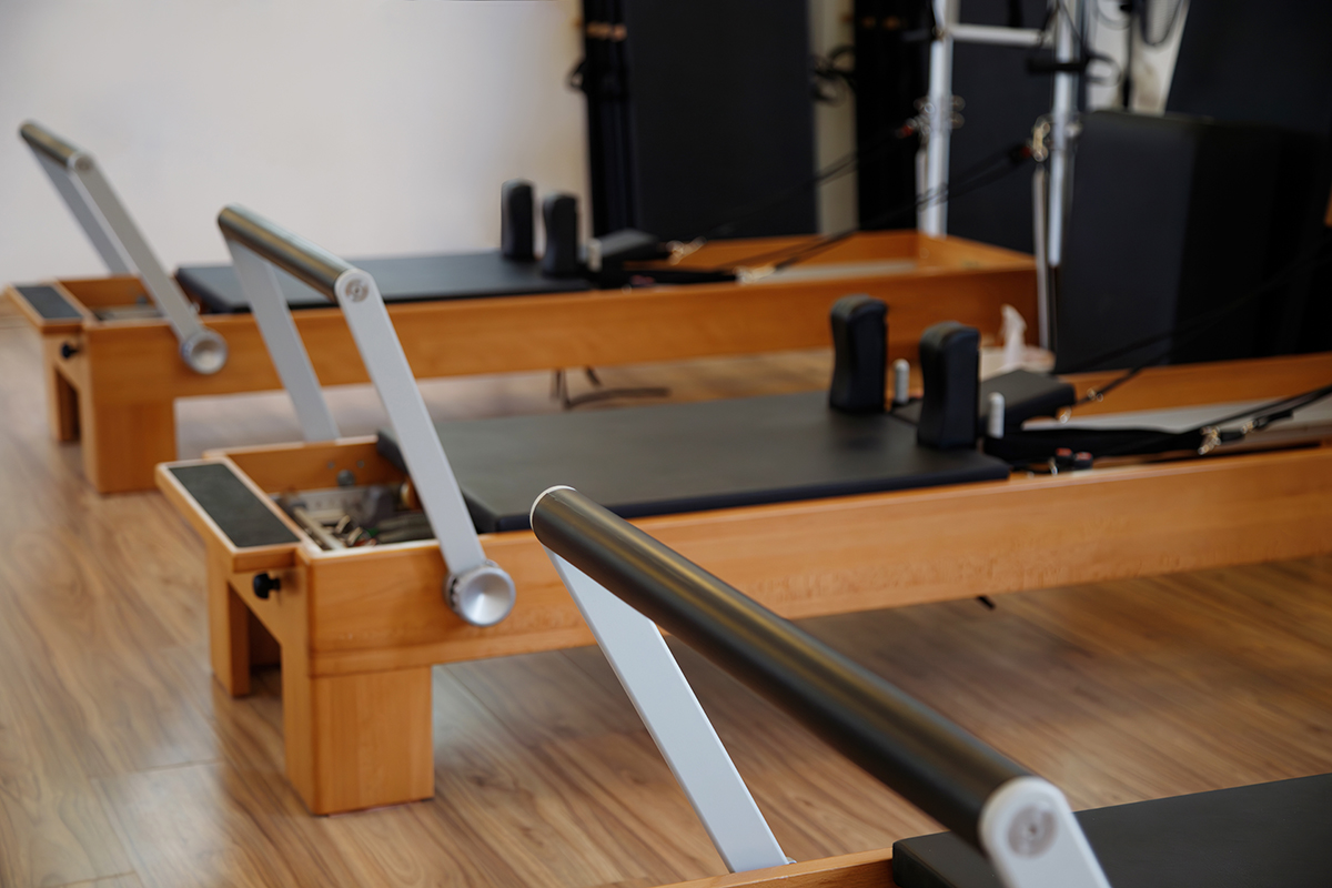 Kansas Built Fitness | Mind & Body classes featuring Yoga and Pilates in Olathe, KS | Pilates studio room with pilates machines